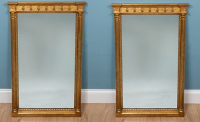 Lot 499 - A pair of giltwood pier mirrors