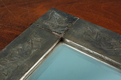 Lot 418 - A mirror with a hammered metal frame decorated with ivy leaf motif