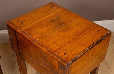 Lot 91 - An oak table with drop leaves together with a Chinese hardwood table