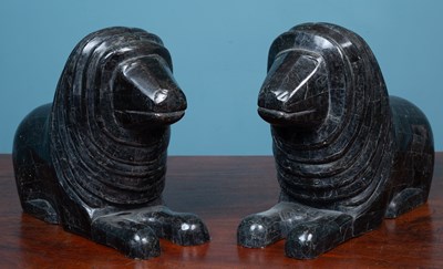 Lot 582 - A sculptural group comprising a pair of lions and a toucan