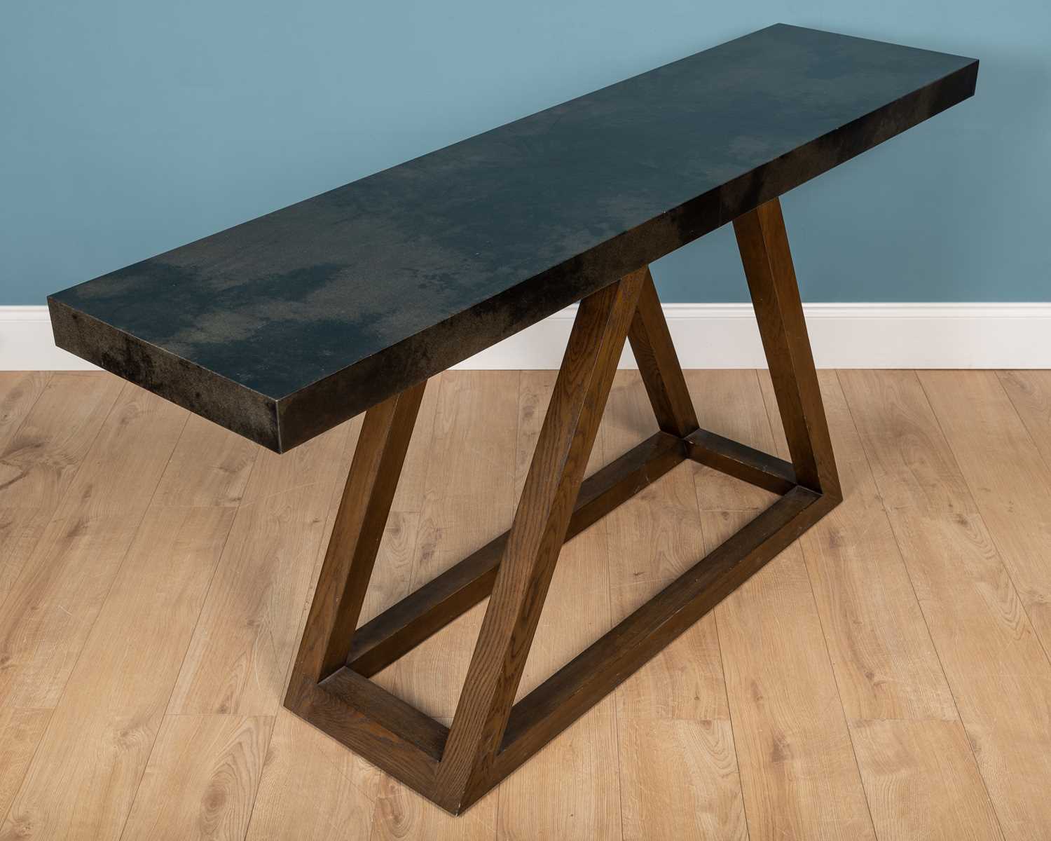 Lot 520 - A triangle black velum and firmdale grey oak console table by Julian Chichester