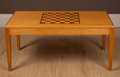 Lot 367 - A Gordon Russel birdseye maple games table with an inlaid chess board