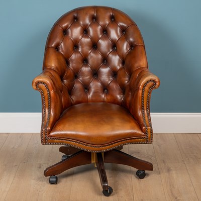 Lot 518 - A modern button backed leather desk chair