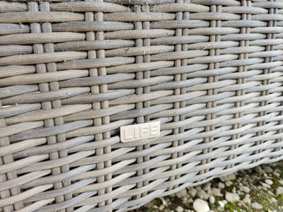 Lot 575 - An oval glass topped garden table together with a set of eight faux wicker chairs