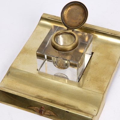 Lot 211 - A brass and glass desk ink stand with an RAF...