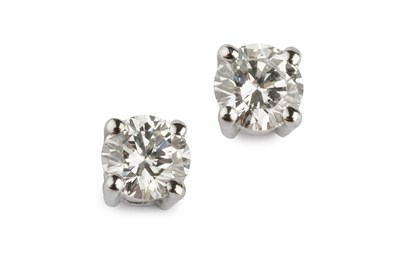 Lot 95 - A pair of diamond ear studs, each round...