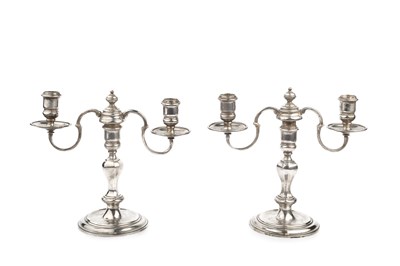 Lot 651 - A pair of silver twin branch candlesticks,...