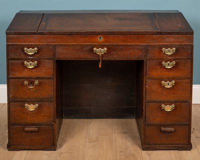 Lot 517 - A 19th century oak pedestal desk