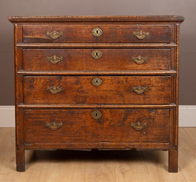 Lot 159 - A 17th century oak chest of four long drawers