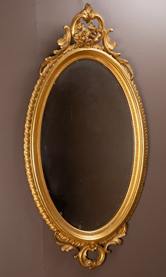 Lot 25 - An antique gilt oval wall mirror