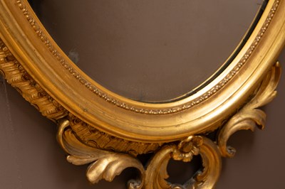 Lot 25 - An antique gilt oval wall mirror