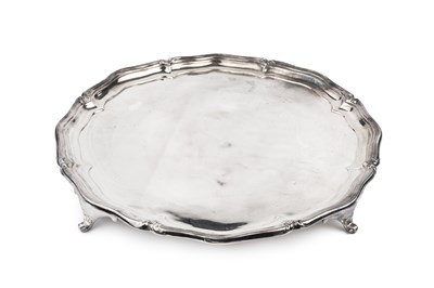 Lot 658 - A George V silver salver, with shaped border...