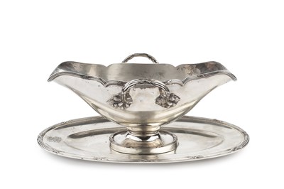 Lot 661 - A Continental silver twin handled sauce boat,...