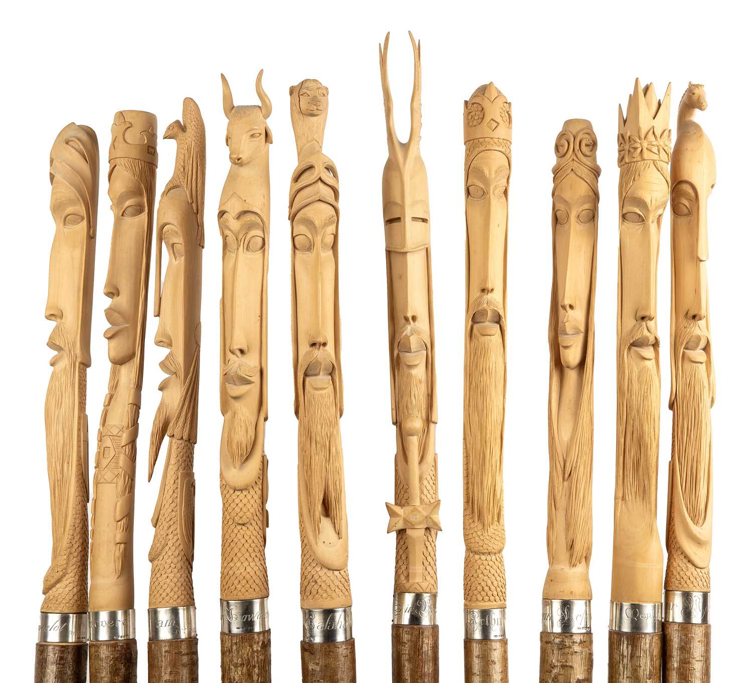 Lot 244 - A set of ten birch wood staffs, each carved...