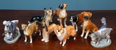 Lot 614 - A pair of Royal Copenhagen figurines; together with four Beswick dogs; and three pottery dogs