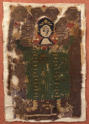 Lot 248 - A coptic cloth fragment, a figure in green....