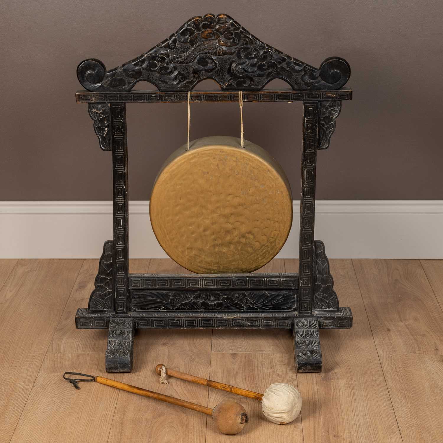 Lot 16 - An antique hardwood framed dinner gong