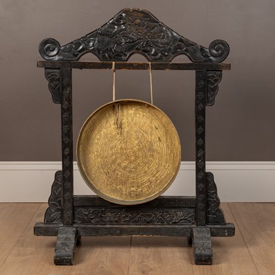 Lot 16 - An antique hardwood framed dinner gong