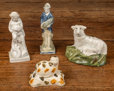 Lot 114 - A group of 18th century pottery figures
