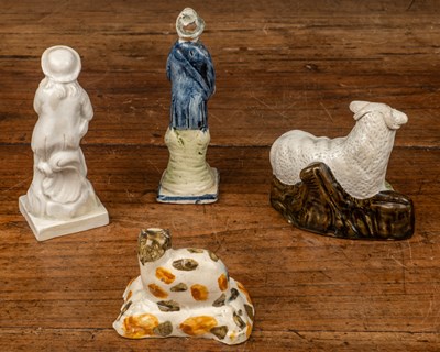 Lot 114 - A group of 18th century pottery figures