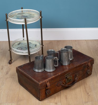 Lot 585 - A suitcase, a drinks trolley, and pewter tankards