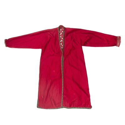 Lot 208 - Red cotton chapan with icat border and printed...