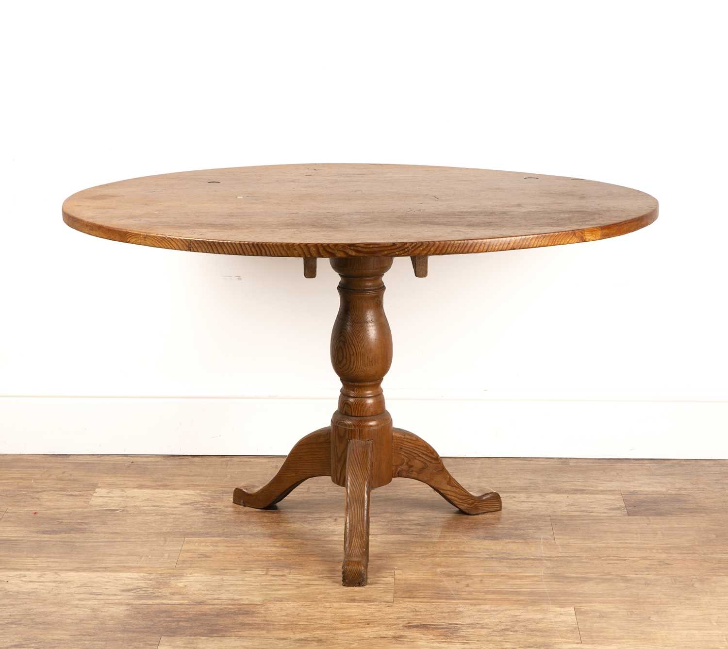 Lot 12 - Pitch pine oval kitchen table with a turned...