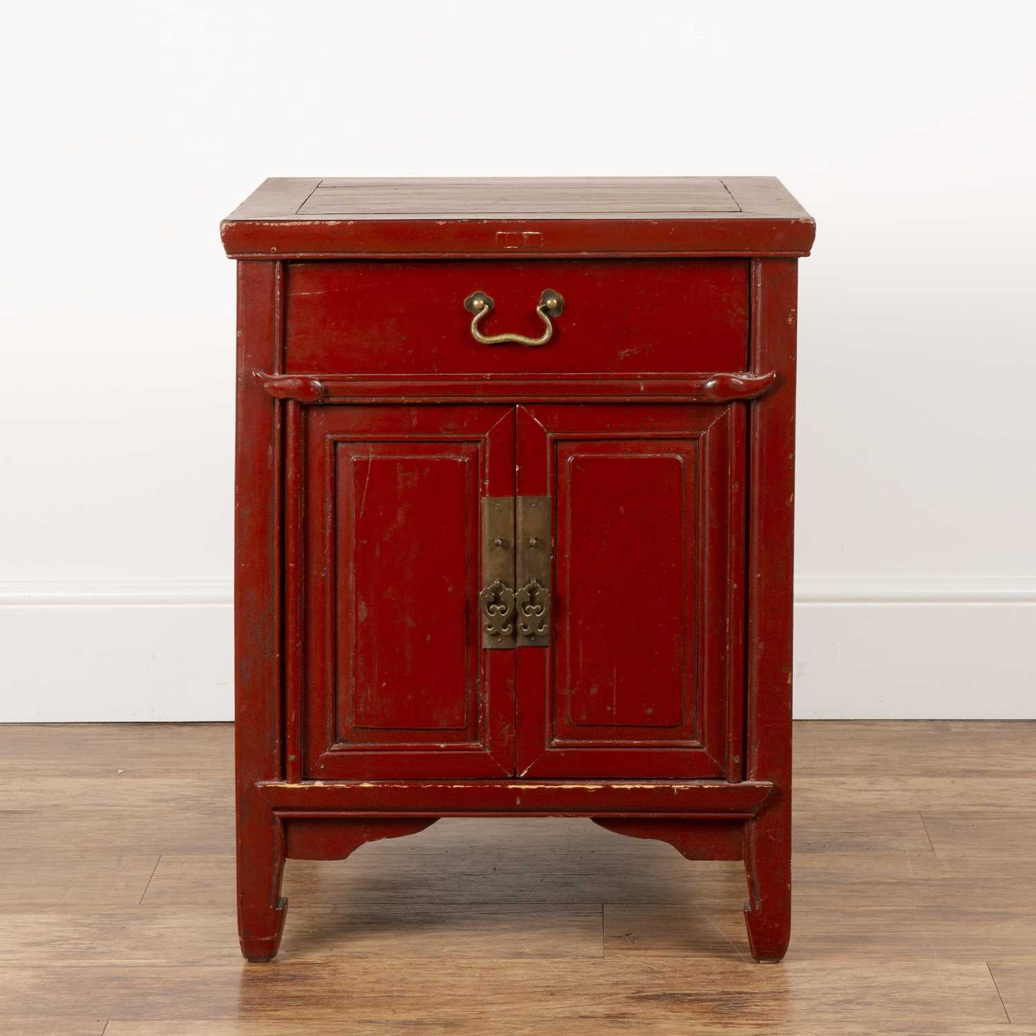 Lot 381 - Red lacquer low cupboard Chinese, fitted with...