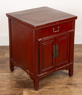 Lot 381 - Red lacquer low cupboard Chinese, fitted with...