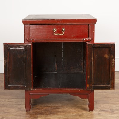 Lot 381 - Red lacquer low cupboard Chinese, fitted with...