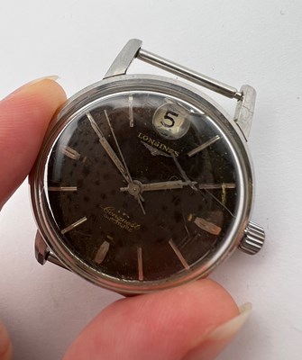 Lot 254 - A 'Conquest' automatic watch head by Longines,...