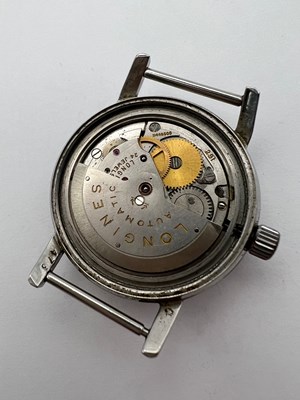 Lot 254 - A 'Conquest' automatic watch head by Longines,...