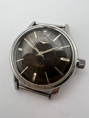 Lot 254 - A 'Conquest' automatic watch head by Longines,...