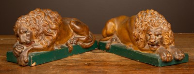 Lot 431 - A pair of painted terracotta recumbent lions