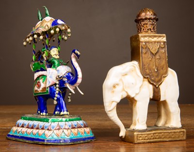Lot 24 - A perfume bottle modelled as an African elephant; together with an enamelled metal elephant
