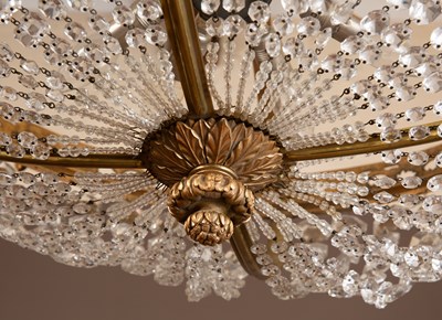 Lot 72 - A 20th century brass-cast lustre drop-glass bag chandelier