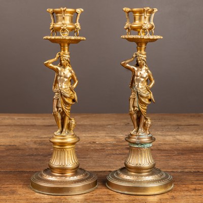 Lot 277 - A pair of gilt brass candlesticks