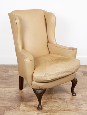 Lot 107 - Leather and walnut wing armchair 19th Century,...