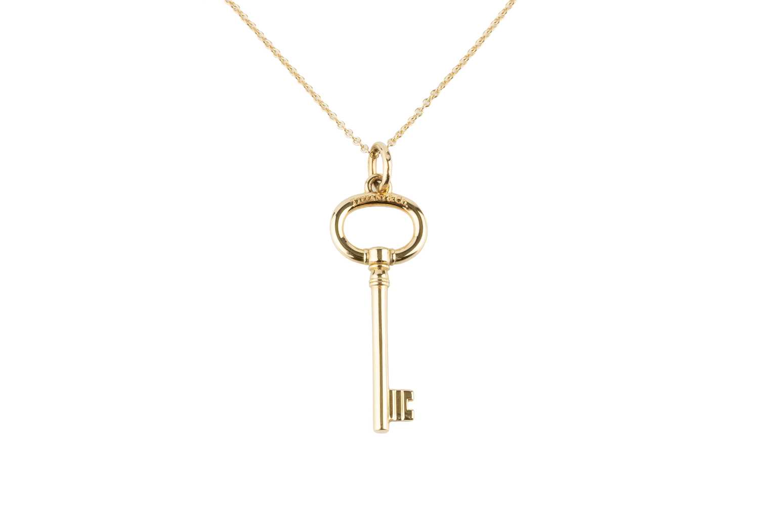 Lot 92 - An 18ct gold 'Keys' pendant on chain by...