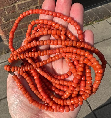 Lot 283 - A collection of coral jewellery, comprising a...