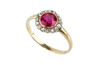Lot 112 - A synthetic ruby and diamond cluster ring, the...