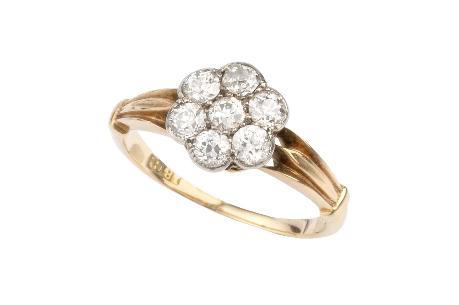 Lot 71 - A diamond flowerhead cluster ring, the old...