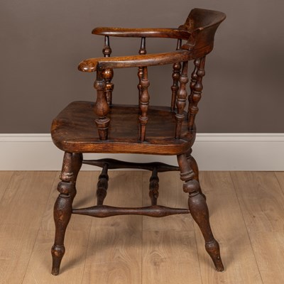 Lot 97 - An antique ash and elm captain's Windsor armchair