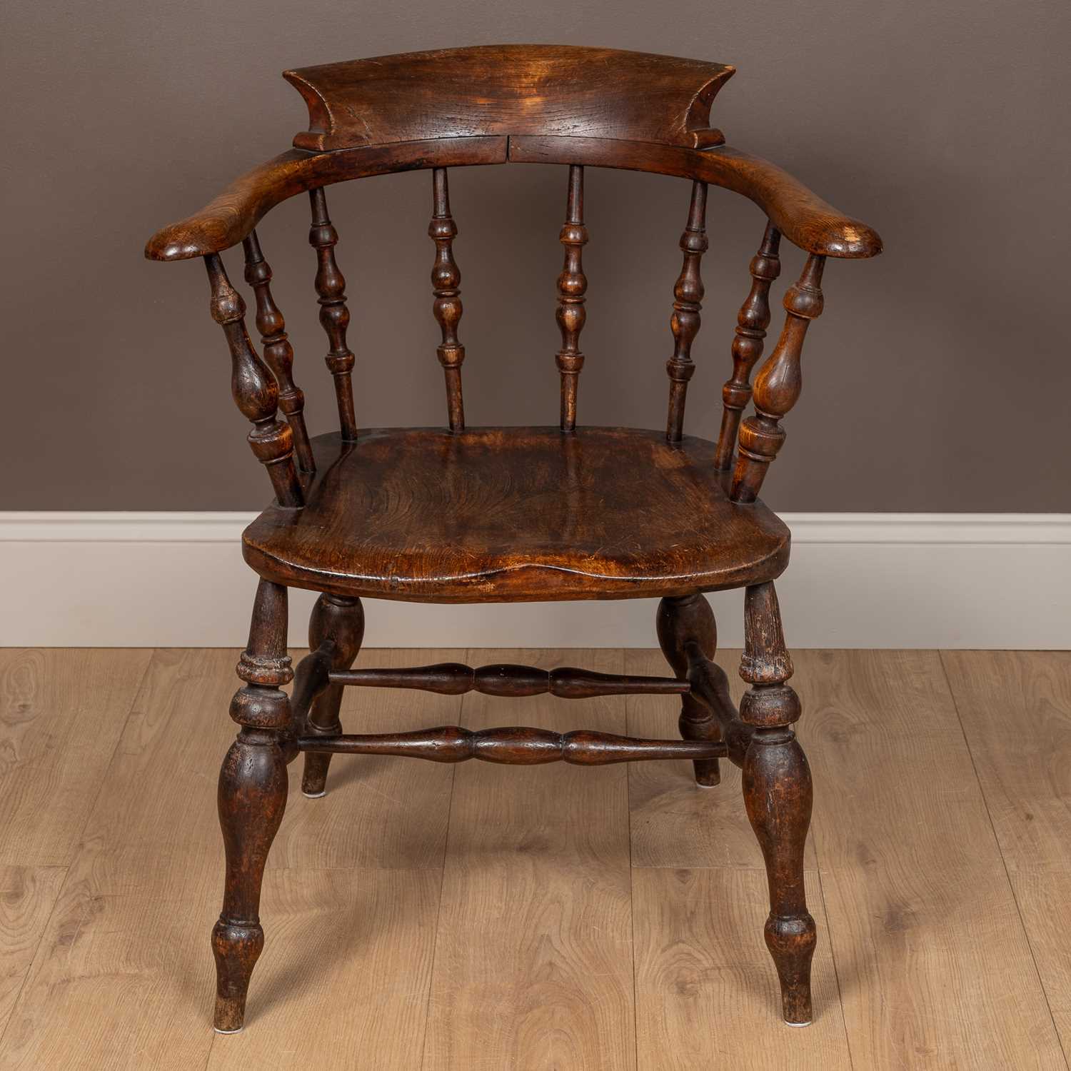 Lot 97 - An antique ash and elm captain's Windsor armchair