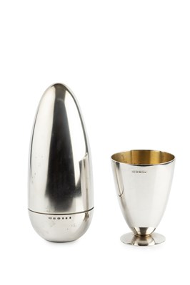 Lot 679 - A silver bullet shaped cocktail shaker, the...