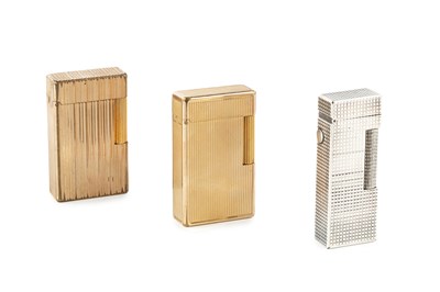 Lot 537 - A silver plated lighter by Dunhill, of...