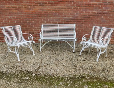 Lot 551 - A set of white painted wrought iron French style garden furniture