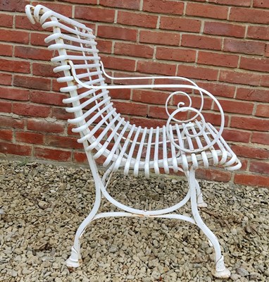 Lot 551 - A set of white painted wrought iron French style garden furniture