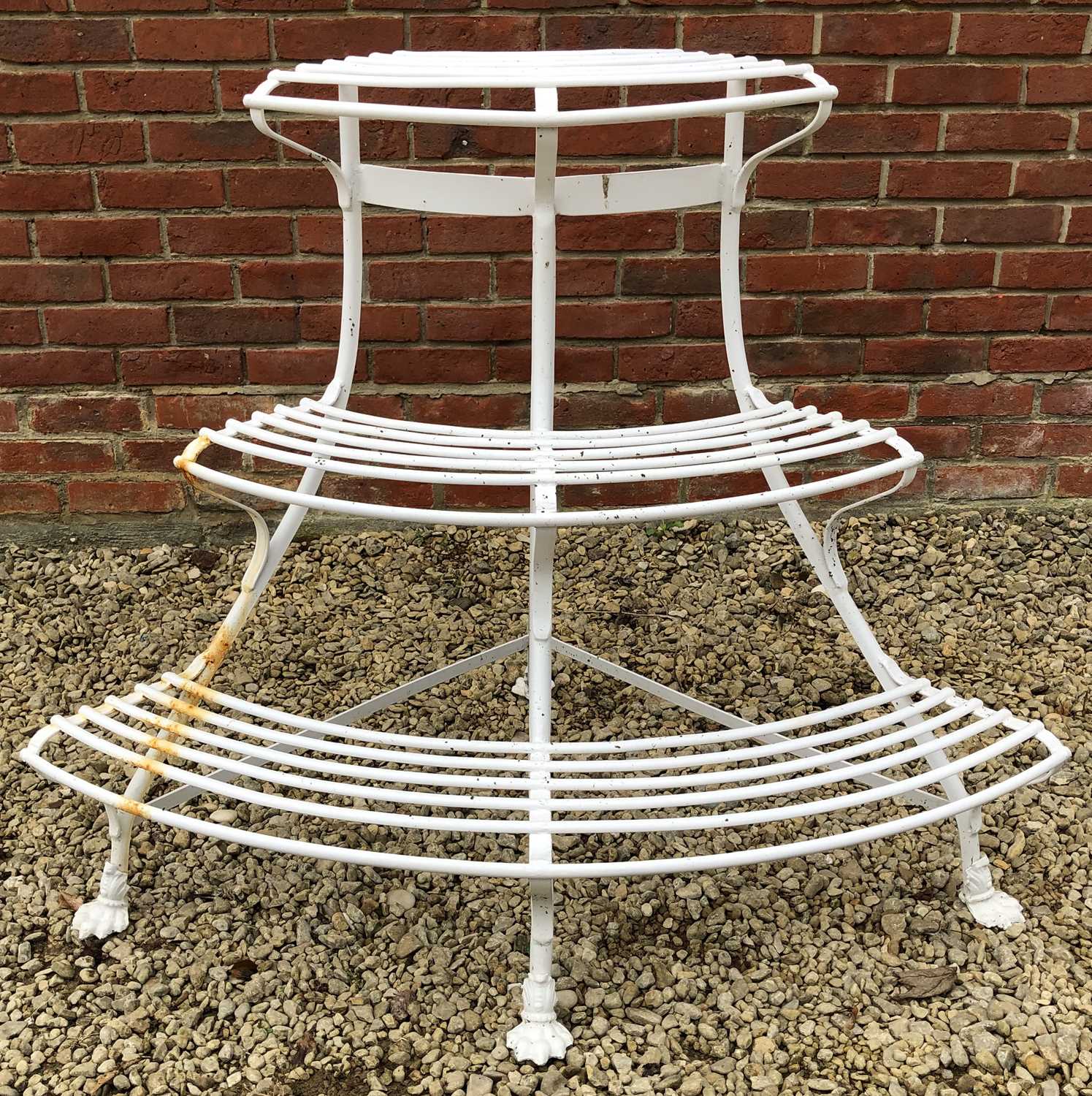 Lot 543 - A white painted wrought iron corner auricular theatre or plant stand