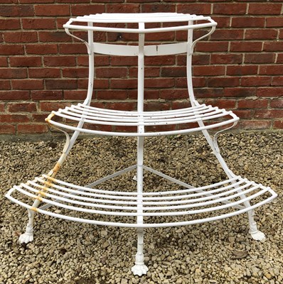 Lot 543 - A white painted wrought iron corner auricular theatre or plant stand